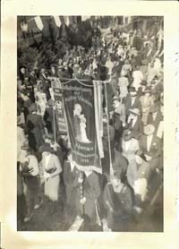 procession/parade - banner appears to represent some religious organization from Adenau with a 1935 date
