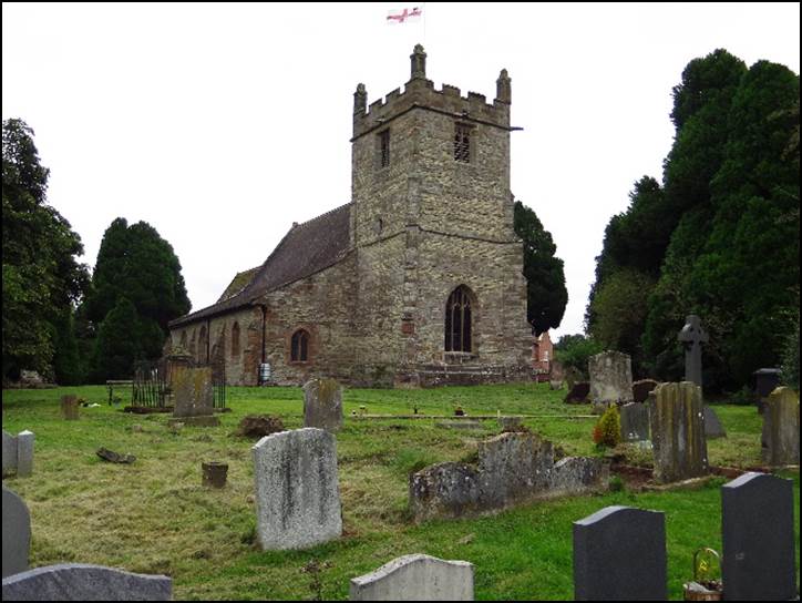 A cemetery with a church in the background

Description automatically generated with low confidence