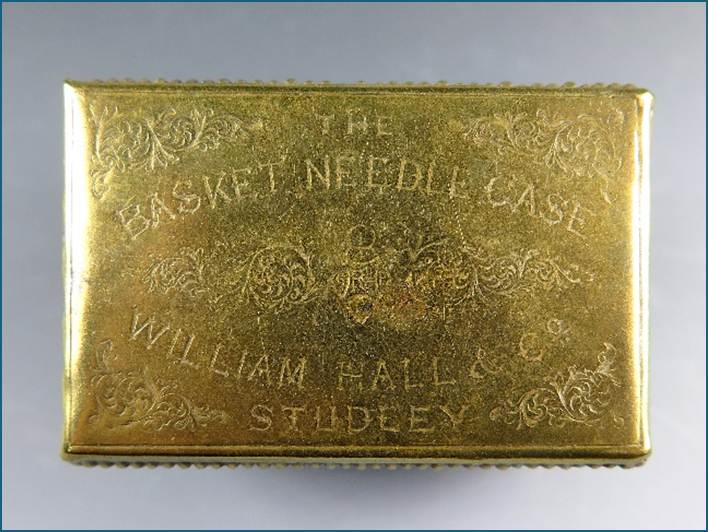 A gold rectangular object with text
Description automatically generated