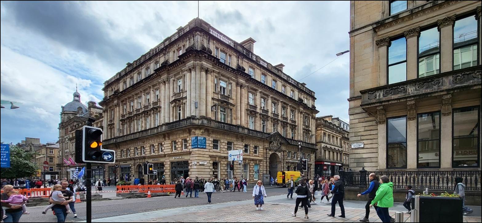 A group of people walking in a city
Description automatically generated