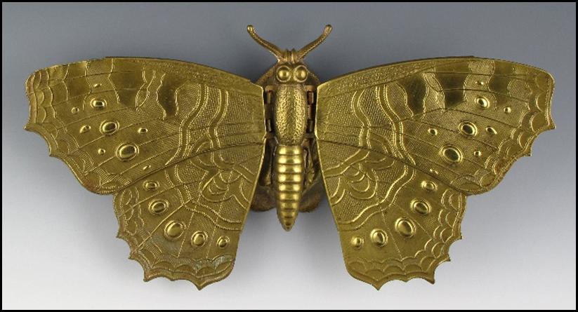 A gold butterfly with wings

Description automatically generated