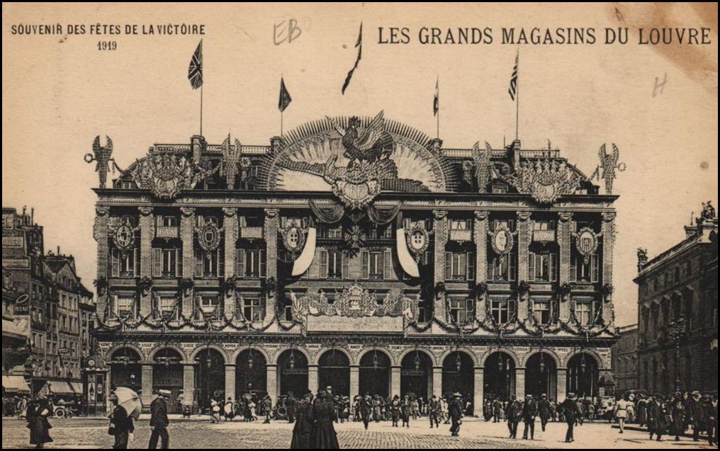 A building with flags on the front

Description automatically generated