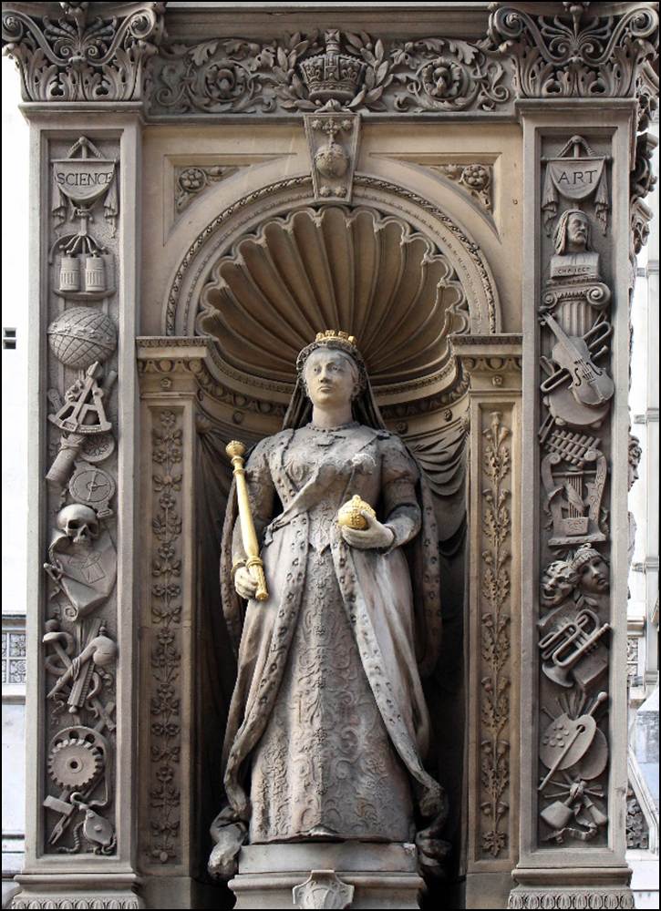 A statue of a person holding a scepter
Description automatically generated