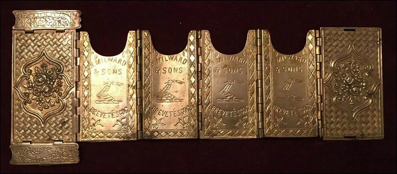 A row of gold metal objects

Description automatically generated