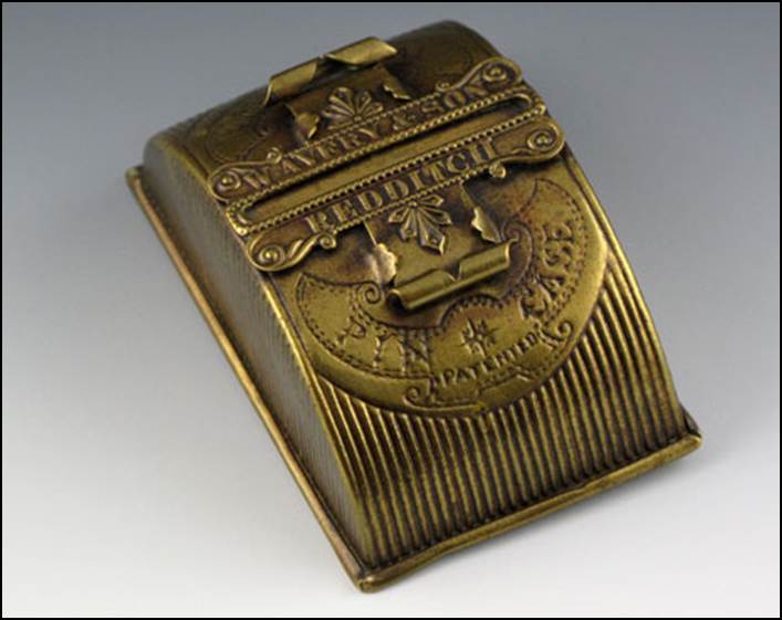 A close-up of a brass cash register
Description automatically generated