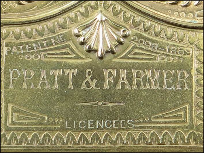 A close-up of a metal plaque
Description automatically generated