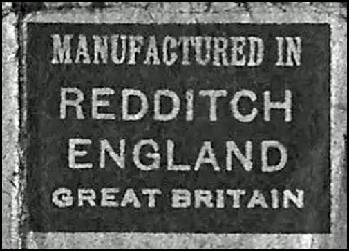 A black and white sign
Description automatically generated