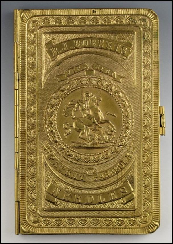 A gold cigarette case with a horse on it

Description automatically generated